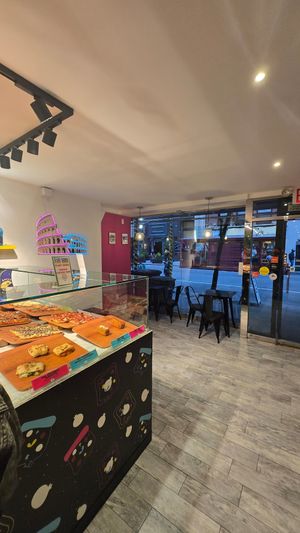 A few seats here at Unregular Pizza - 37th St in New York City