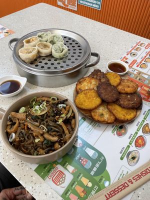 Mix vegetable and kimchi dumplings pancakes and soy sauce noodles  at Bibibim in Busan