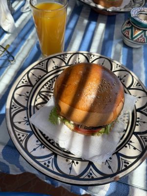 Falafel burger with orange juice   at Restaurant La Réception in Tangier