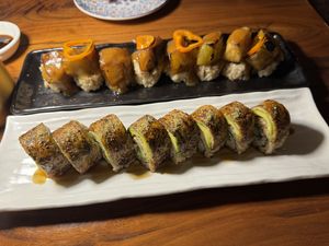 Dragon roll in the front; roll with eggplant in the back (don’t recall name but it was amazing!)  at Shojin - Culver City in Culver City