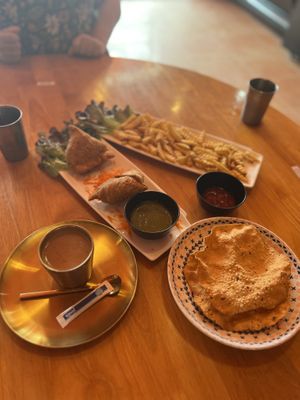 Masala chai, samosas, papads (and chips for my friend's kid).  at Ahaara Veda Indian in Koh Phangan