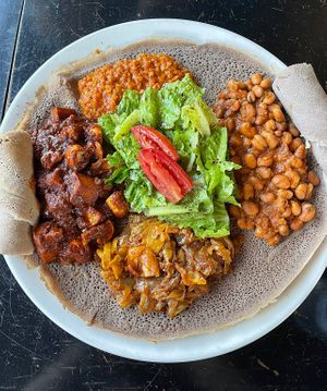 (clockwise) lentils, fava beans, cabbage, mushroom/potatoes   at Muzita Abyssinian Bistro in San Diego