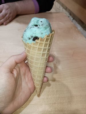 Mint Oreo dairy-free ice cream with a waffle cone at Legendairy Cookies 'N Creamery in Appleton