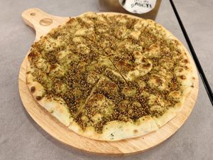 Vegan Green Zaatar Manaeesh at Operation Falafel  in Abu Dhabi