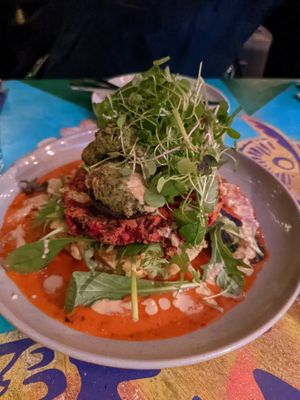 Stuffed mushrooms over a veggie fritter and mashed vegetable based  at East St Cafe and Bar in Nelson