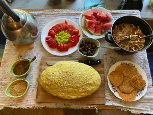 All vegan breakfast. Homegrown tomatoes and figs, homemade hummus and fresh baked bread  at The House in the Village in Pellumbas