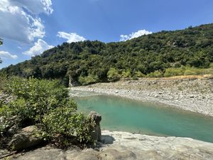 The river - 30 minutes walk   at The House in the Village in Pellumbas