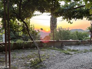 Sunset in the garden   at The House in the Village in Pellumbas