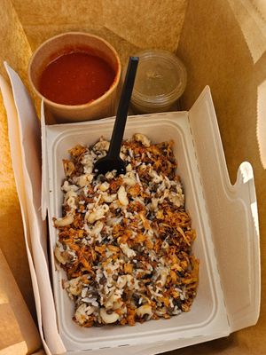 Koshari, baked onions, sauces at Abu Amr Koshari  in Amsterdam