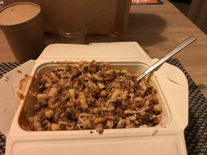 The box with koshari after all the mixture  at Abu Amr Koshari  in Amsterdam