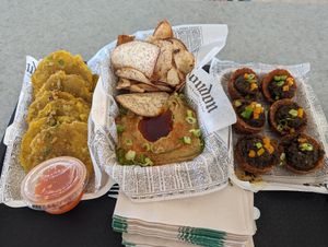 Tostones, hummus and pita chips, alcapurrias at El Cuchifrito in Catano