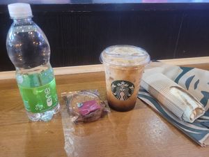 Sparkling Water, Ginger Biscuits, Iced Brown Sugar Oat Shaken Espresso and Fiery No'Chicken Wrap at Starbucks Coffee in Broughton