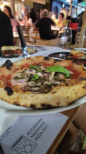pizza with mushrooms, vegan cheese, onions and pesto at Bigalia in Mendoza