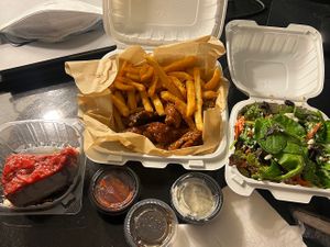 Strawberry cheesecake, bbq and chili wings with fries and salad. I recommend them all!   at Vegan Wangs in Atlanta