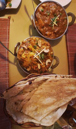 2 curries and garlic naan at Coriander in Phnom Penh