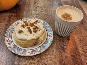 Ginger biscuit roll and chai latte at Busy V Bakery  in Bristol