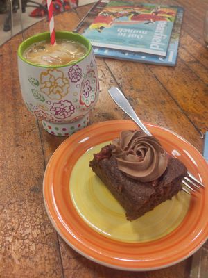 Chocolate and raspberry cake and iced latte at Busy V Bakery  in Bristol