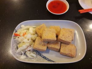 Famous stinky tofu with cabbage salad at Cool Cool in Phnom Penh