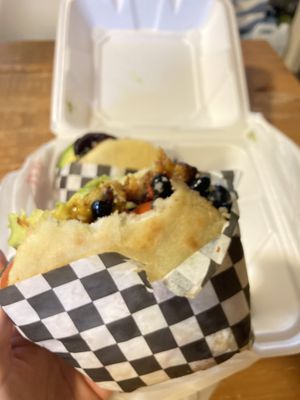 Vegetarian arepa with beans, avocado and plantains  at La Vaca Mariposa in Bozeman