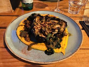 Baked eggplant with carrot hummus. Bad picture because it was dark, but the dish was the best I had in Croatia.  at Hvar Brewing Co in Hvar