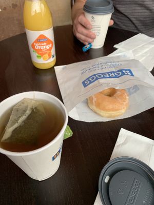 Donut, tea, orange juice  at Greggs - St Pancras Station in North West London