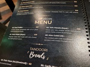 Vegan section on the menu with confusing items such as ghee and milk products at Leela Indian Restaurant  in Bergen