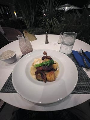 (wide angle shot) Spicy vegan curry from the dinner menu.  Lava flow cocktail at Hawaii Calls in Waikoloa