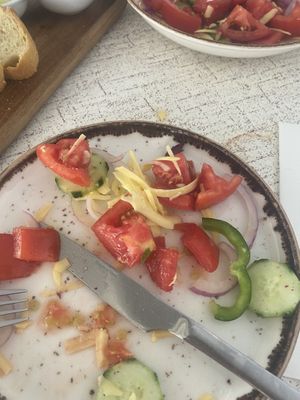 Greek salad half eaten as forgot to take photo!    at Patio Dining in Vasiliki
