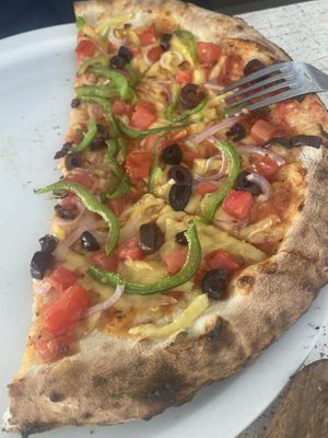 Mediterranean pizza with feta removed & vegan cheese added   at Patio Dining in Vasiliki