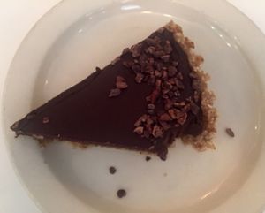 raw cocao mousse pie slice: cocao, date, avocado mousse in a walnut coconut date crust. $8 at Peacefood Cafe - Downtown in New York City