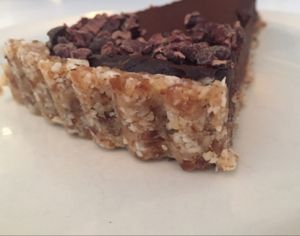 raw cocao mousse pie slice: cocao, date, avocado mousse in a walnut coconut date crust. $8 at Peacefood Cafe - Downtown in New York City