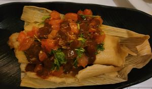 Tamale, one of specials not on menu. Best tamale I ever had! Topped woth a tomato sauce. at Peacefood Cafe - Downtown in New York City