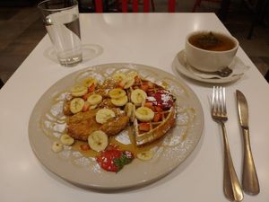Chicken and waffles with peppermint tea at Peacefood Cafe - Downtown in New York City