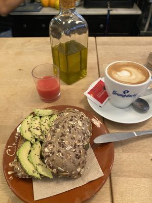 Pan con aguacate y Tomate y un Café con leche de avena   at La Clandestina Librería-Café in Cadiz