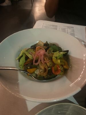 Dish with grilled baby corn and zucchini over baba ganoush  at Crossroads Kitchen in Los Angeles