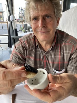 Kelp caviar, sour cream and blini  at Crossroads Kitchen in Los Angeles