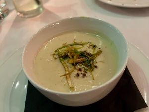 Cauliflower & Leek Soup with truffle dust and crispy leeks. at Crossroads Kitchen in Los Angeles