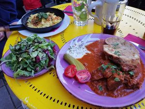 Sojagulasch mit Serviettenknödel und Käsespätzle at Cafe Harvest in Vienna