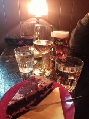 Peanut chocolate cake and vegan wine at Cafe Harvest in Vienna