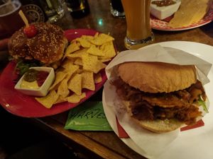 Beyond burger with tortillas and seitan "döner" pieces with tzatziki  and onion in a bun at Cafe Harvest in Vienna