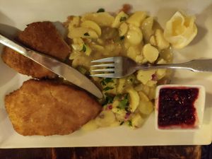 Schnitzel with potato salad and lingonberry at Cafe Harvest in Vienna