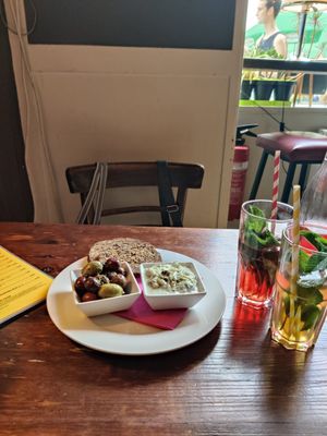 olives, tzatziki and oat bread starter (left) and homrmade lemonades (right) at Cafe Harvest in Vienna