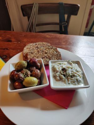 olives, tzatziki and oat bread starter at Cafe Harvest in Vienna