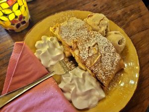 Apple strudel with whipped cream at Cafe Harvest in Vienna