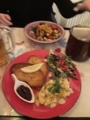 Schnitzel with warm potato salad   at Cafe Harvest in Vienna