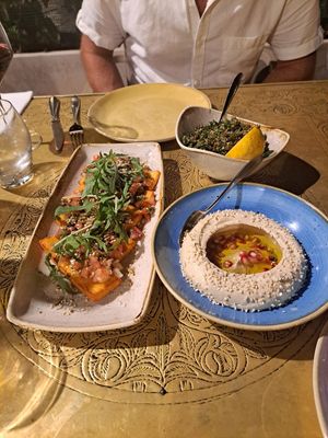Halloumi starter, sides of humus, tabbouleh. at Leyla Lebanese Cuisine in St Julians