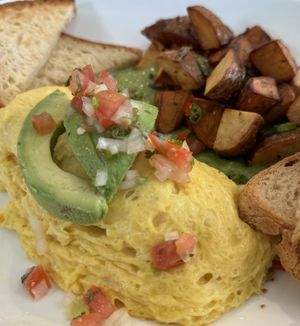 Vegetable omelet with plant-based eggs and cheese  at Pistachio Kitchen in San Francisco