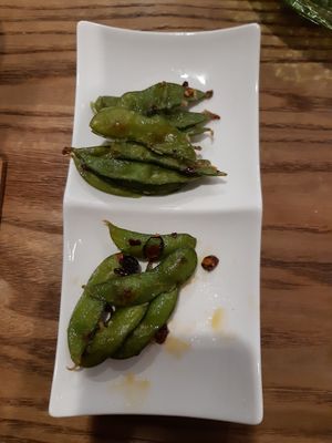 Half eaten peperoncino edamame (a delicious and free side dish) 😋 at The Veggie Table in Sendai