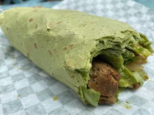 Chimichurri Seitan Wrap in spinach tortilla  at Conscious Cravings - South Austin in Austin