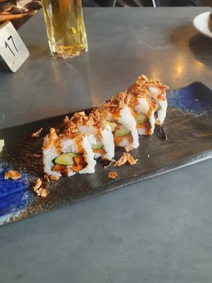 Veggie crunch roll: sweet potato, cucumber and avocado inside teriyaki sauce and fried onions on top at Zumuku Sushi in Wilmslow